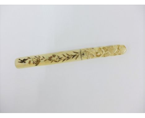 Early 20th century Japanese carved ivory page turner, the handle with octopus and fish, 25cm long 