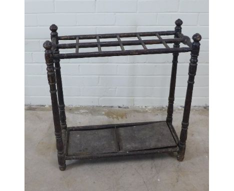 19th century black painted wooden stick stand with twelve apertures, 60 x 65 x 26cm 