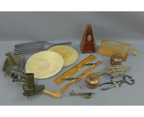 Carton containing mixed items to include brass chamber stick and trivet, copper burners, metronome, Coombes ruler, pine box w