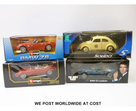 Four Burago, Solido and other 1:18 scale diecast model vehicles including James Bond, BMW, Police VW Beetle, etc. all in orig