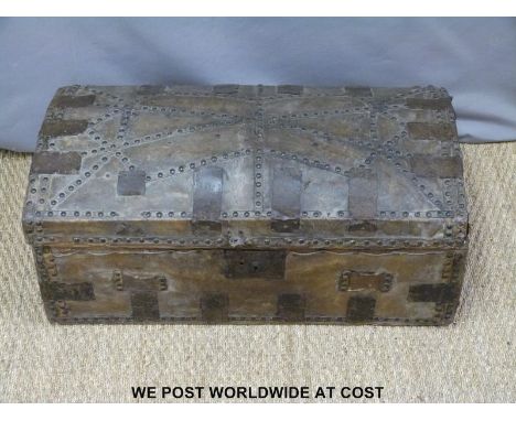 A 19thC metal-bound studded leather trunk (W76 x D40 x H30cm)