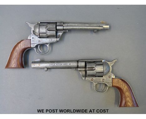 A pair of metal .45 Army replica six-shot revolvers. 