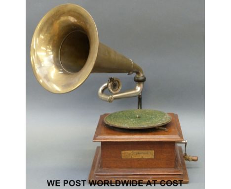 A vintage gramophone with brass horn, with label for The Gramophone and Typewriter, 21 City Road, London; approximately early