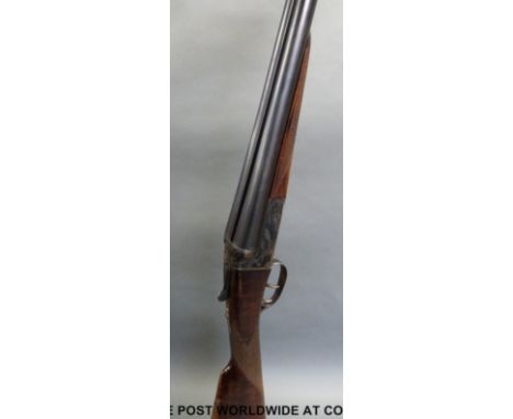 AYA model 4 12 bore side by side shotgun with ornate engraving , chequered grip and forend, double trigger and 28 inch barrel