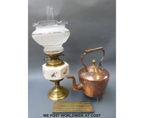 A copper kettle, brass oil lamp and brass cribbage board