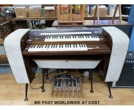 A circa 1960s double keyboard electronic organ by Bird, with full octave foot bass and twenty six couplers, built in twin spe