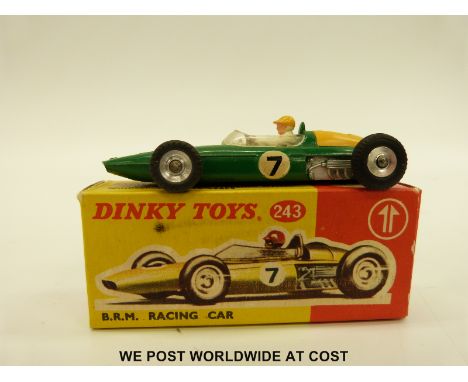 Dinky Toys diecast model B.R.M Racing Car with green body and red engine cover, racing number 7, 243, in original box. 