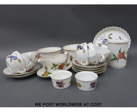 A collection of Royal Worcester Evesham Gold to include flan dish, soufflé dishes, soup bowls, gravy boat etc