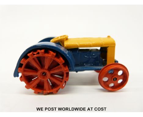 Dinky Toys diecast model Fordson N tractor with blue and yellow body and red wheels 