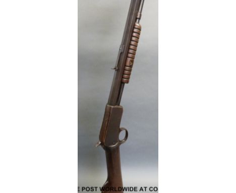Winchester model 1890 .22 long pump action rifle with named 23.5 inch octagonal barrel, overall length 103cm, serial number 2