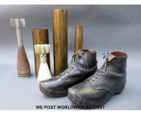 A collection of brass shell cases, mortars, vintage clogs/boots etc.