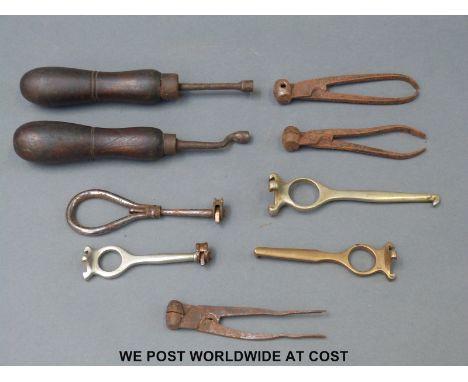 Nine shotgun cartridge decappers, bullet moulding and similar tools. 