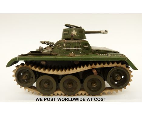 West German tin plate Gama tank with green body and white rubber tracks