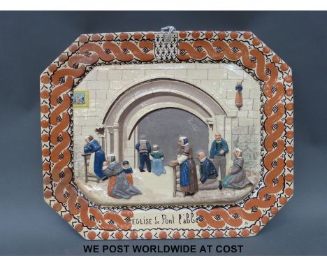 A French relief moulded ceramic plaque