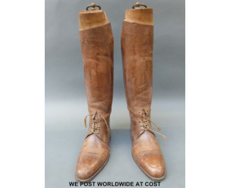 A pair of vintage brown leather riding boots complete with wooden trees, approximately size 11, marked D Maclaron 109 Piccadi