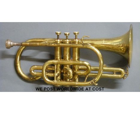 A "Lark" Chinese brass cornet , no. M4045, fitted with white metal conical shaped mouth piece, complete with case