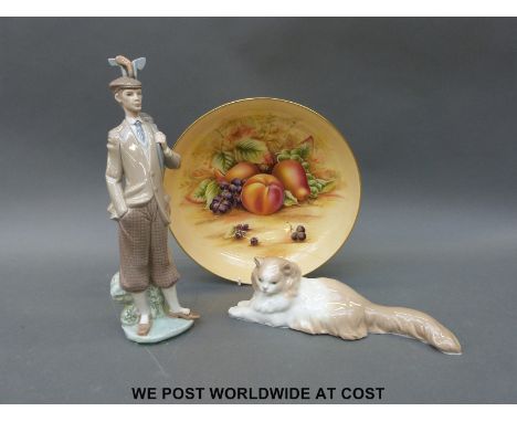 Lladro golfer figure and Nao cat, both with boxes and an Aynsley Orchard Gold fruit bowl 