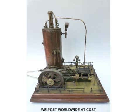 A stationary live steam engine with vertical boiler, horizontal single cylinder engine, Marklin governor, feed pump and mecha