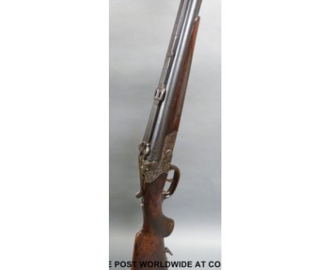 August Wolf Suhl 16 bore and 8mm x 57 drilling combination rifle and shotgun with heavily engraved locks, barrels, top plate 