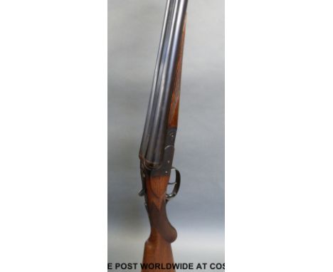 BSA 12 bore side by side shotgun with chequered semi-pistol grip and forend and 28 inch barrels, overall length 113cm, serial