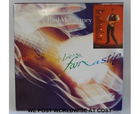 Rare Paul McCartney LP: “Tripping The Live Fantastic” (1990 3xLPs with inners and booklet). The vinyl appears to be unplayed.