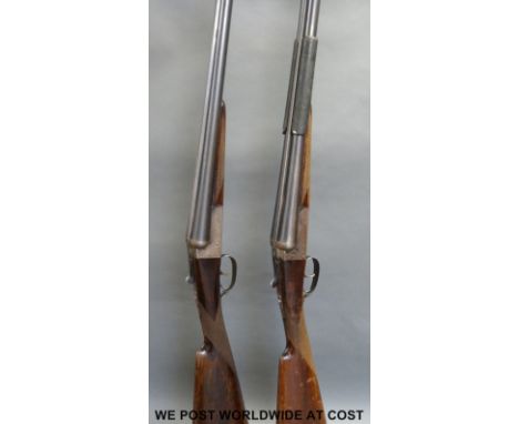 Matched pair of AYA Yeoman 12 bore side by side shotguns with chequered grips, double triggers and 28 inch barrels, serial nu