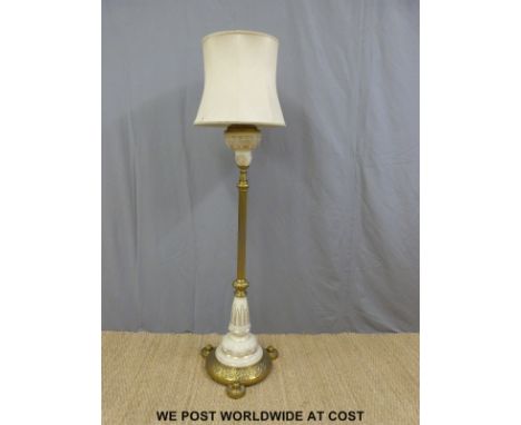 A brass and ceramic standard lamp converted from oil
