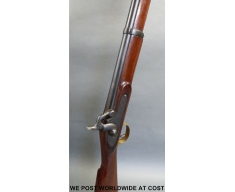 Single barrelled percussion hammer action smooth bore gun with proof marks to the 21 inch barrel and brass trigger guard and 