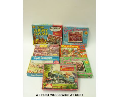 A quantity of vintage jigsaws to include railway, horse racing, country scenes etc