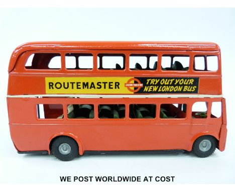Tri-ang Minic tin plate clockwork Routemaster Bus with red body and 'Try Out Your London Bus' and 'The Camera People' decals