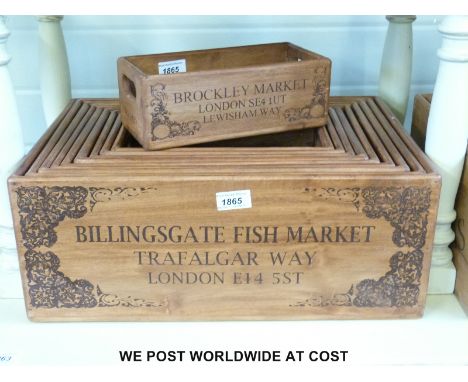 A set of ten wooden vintage style storage/retail boxes with fish theme, largest 48cm long