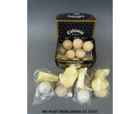 A collection of vintage golf balls including Penfold, Gutta Percha, Fred Freemantles, Spalding, Bernard Langer signed example