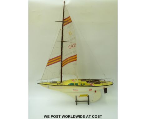 A Russian 1:10 scale model racing yacht, in original box together with a battery powered fire engine 