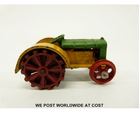 Dinky Toys diecast model Fordson N tractor with green and yellow body and red wheels 