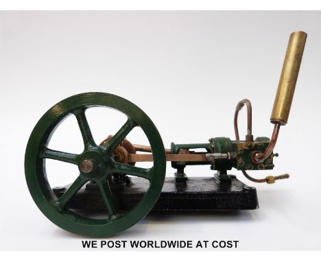 A stationary live steam engine with single cylinder slide valve engine, mounted on a bedplate