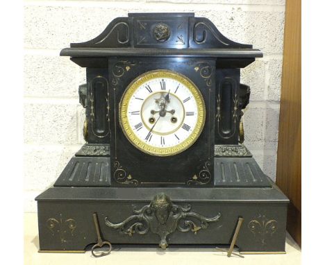 A large black marble mantel clock of architectural form, the case with gilt detail and gilt metal mounts, two-piece white ena