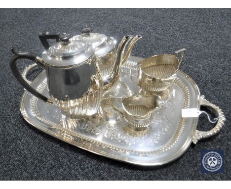 A four-piece Walker &amp; Hall plated tea service on plated twin-handled tray 