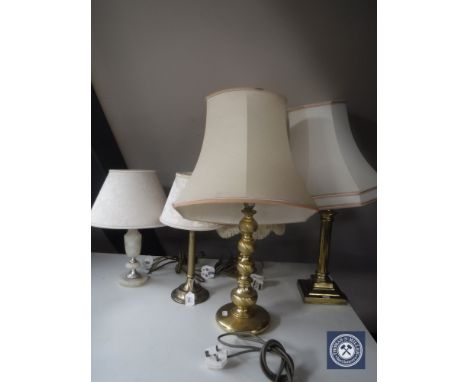 Four assorted brass table lamps and an onyx table lamp 