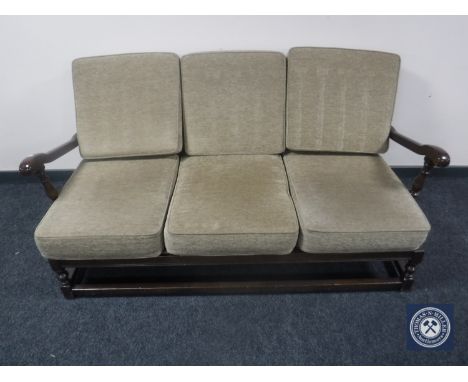 A wood framed Ercol three-piece lounge suite 
