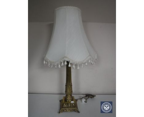 A heavy brass table lamp with shade 