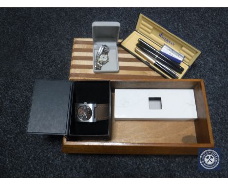 A wooden trinket box containing Waterman and Parker fountain pens/ball-point pen, gent's Bench wristwatch, lady's Seiko wrist