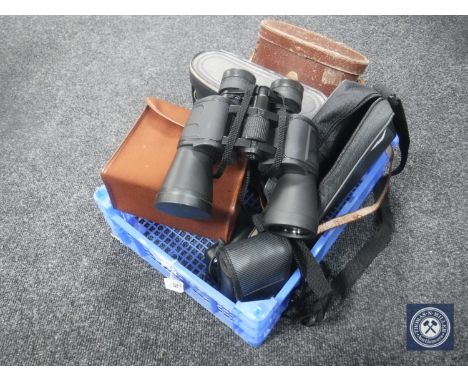 A basket of three sets of binoculars - Super Zenith, Liebernen Gortz etc, cameras etc 