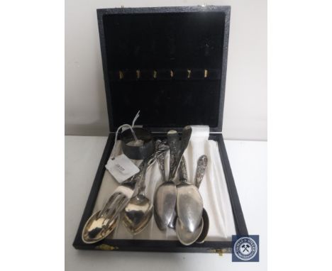 A box of silver napkin ring, set of five continental silver teaspoons, silver fork and three Britannia silver teaspoons