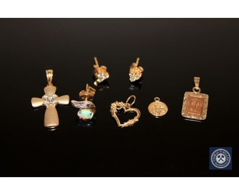 A pair of 9ct gold diamond set earrings, a single diamond and opal earring and four gold pendants (7)