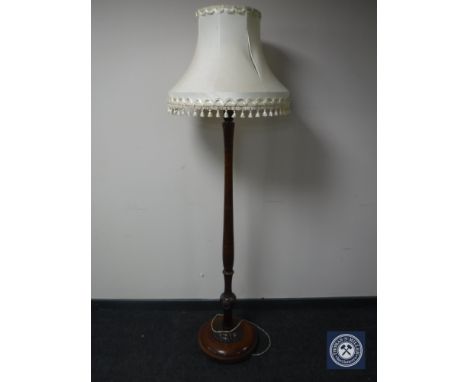 A 20th century mahogany standard lamp and shade 