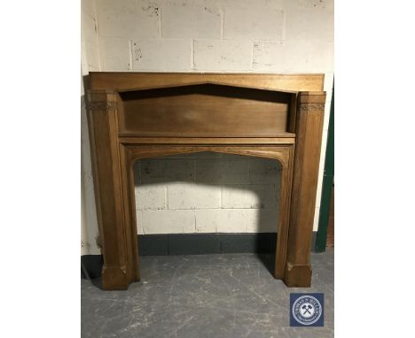 An early 20th century oak fire surround