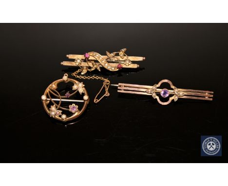 Two amethyst and seed pearl brooches and a ruby and seed pearl brooch (3) CONDITION REPORT: 8.2g gross