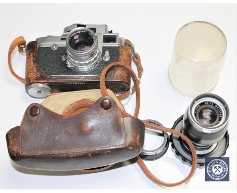 A Leica M2 961432 circa 1959, with Summicron 5cm f2 No 1579325, Elmar 90m f4 No 1713718. CONDITION REPORT: Shutter not windin