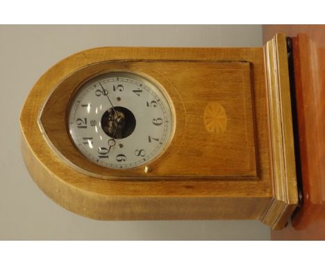 Bulle electric clock, mahogany lancet shaped top case, inlaid with satinwood shell motif and stringing, silvered Arabic dial 