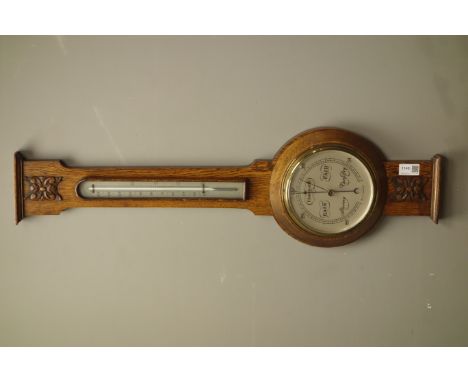 Early 20th century oak cased aneroid barometer with mercury thermometer, H80cm   Condition Report   Click here for further im